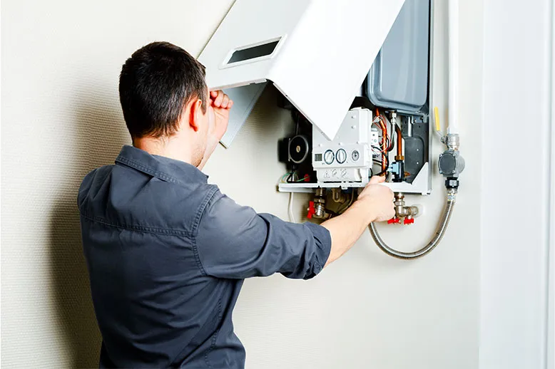 skilled technician diligently repairs a gas boiler in a room, ensuring warmth and comfort for all.